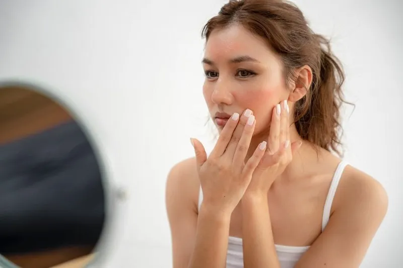 How does blood pressure affect the skin