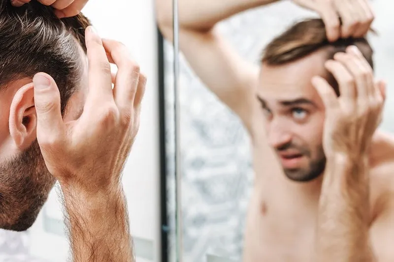 Protecting hair against the effects of steroids